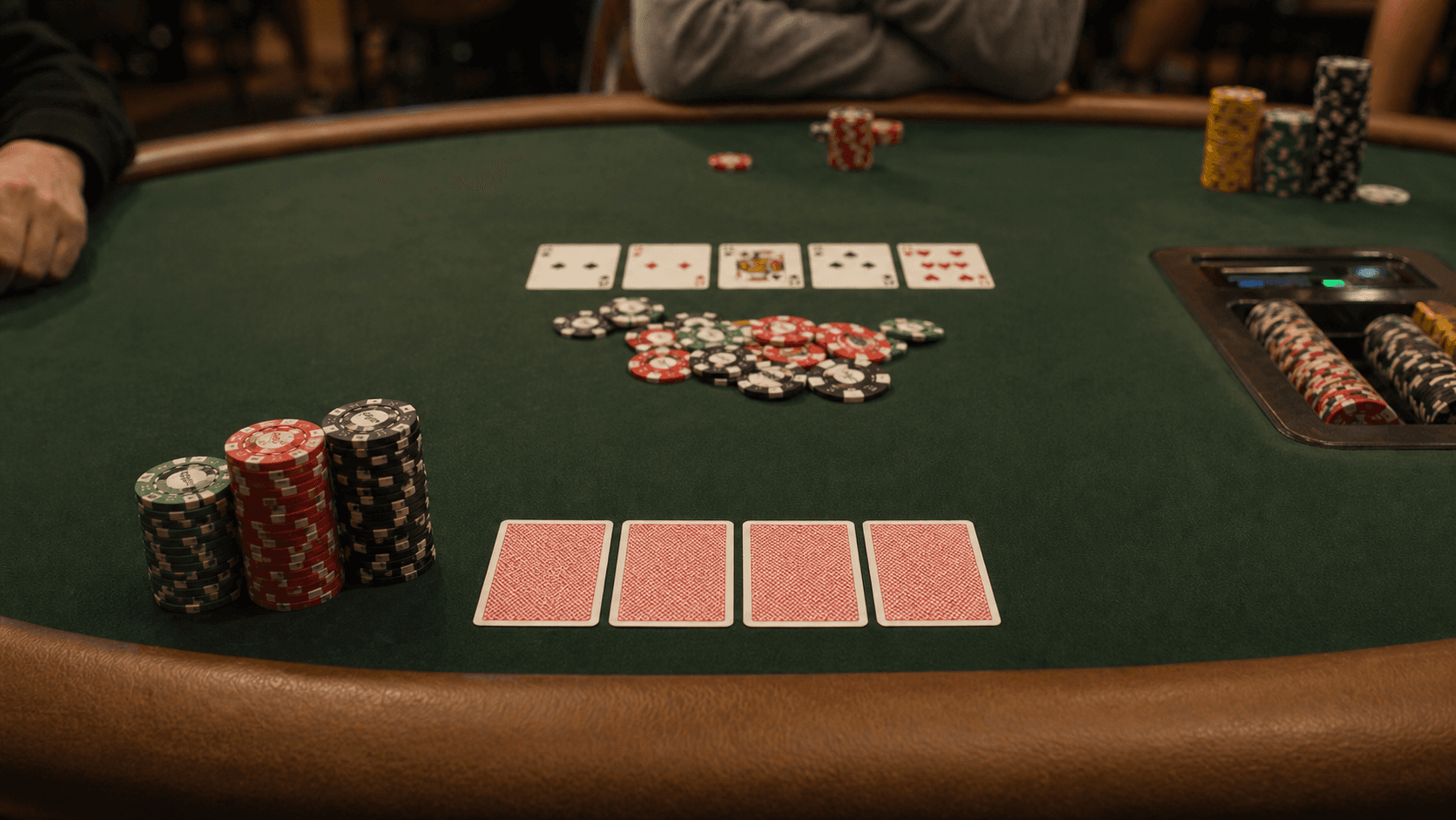 Shallow stacks and board cards sit in the middle of a live pot with little room left to maneuver.