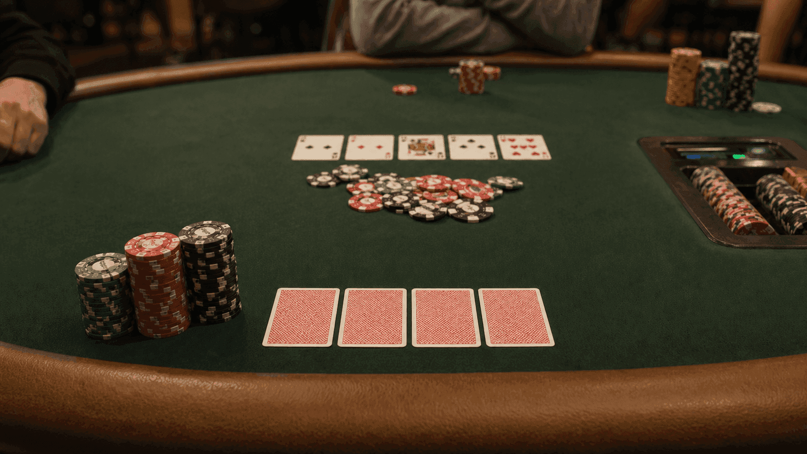 Shallow stacks and board cards sit in the middle of a live pot with little room left to maneuver.
